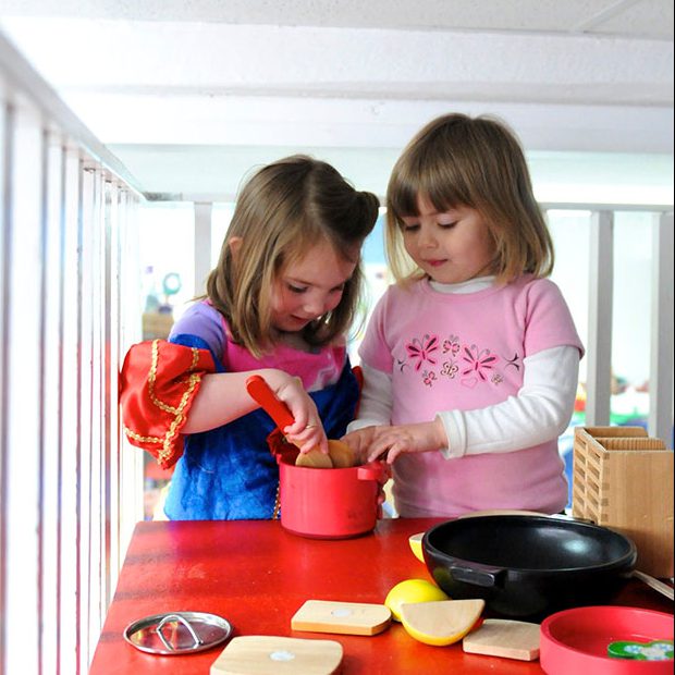 Two girls playing house