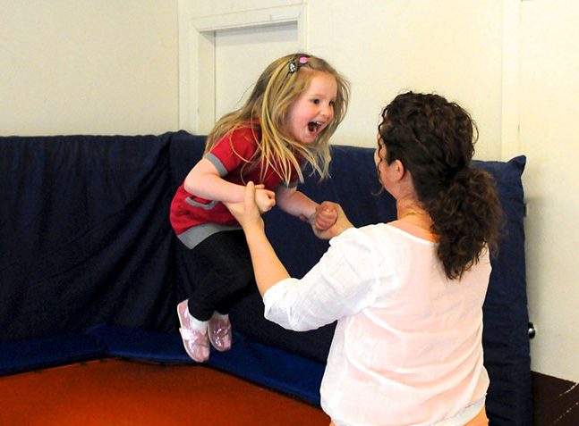 Jumping on the trampoline with mum